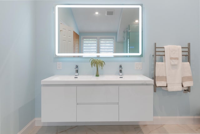 6 Shadow Ln, Norwalk, CT 06851 - bathroom with a towel warming rack, double vanity, a shower stall, and baseboards