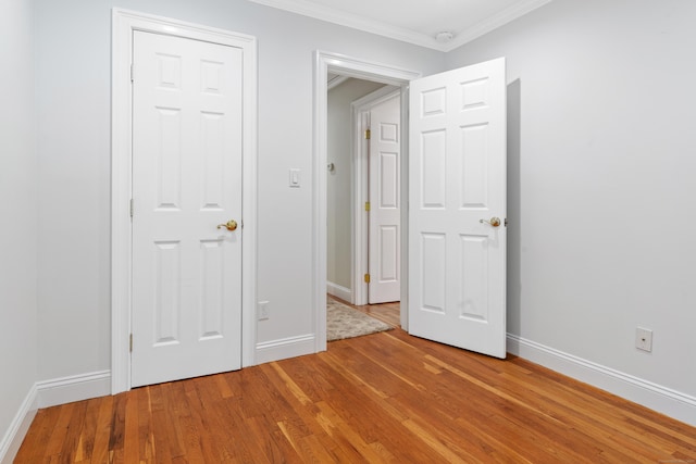 6 Shadow Ln, Norwalk, CT 06851 - unfurnished bedroom with light wood finished floors, ornamental molding, and baseboards