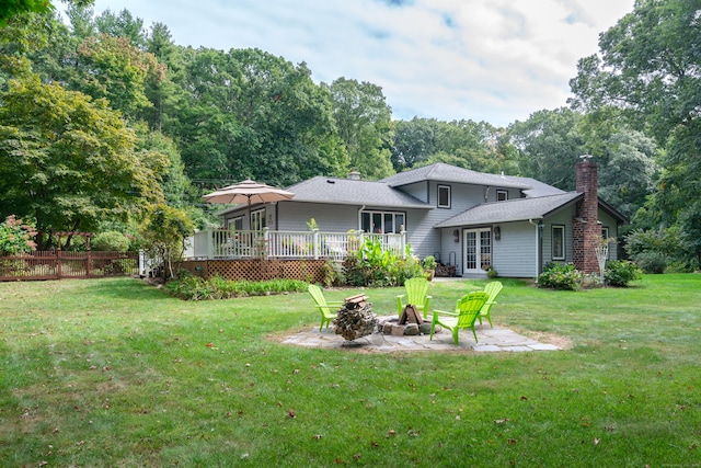 6 Shadow Ln, Norwalk, CT 06851 - back of property with a fire pit, a chimney, french doors, and a wooden deck