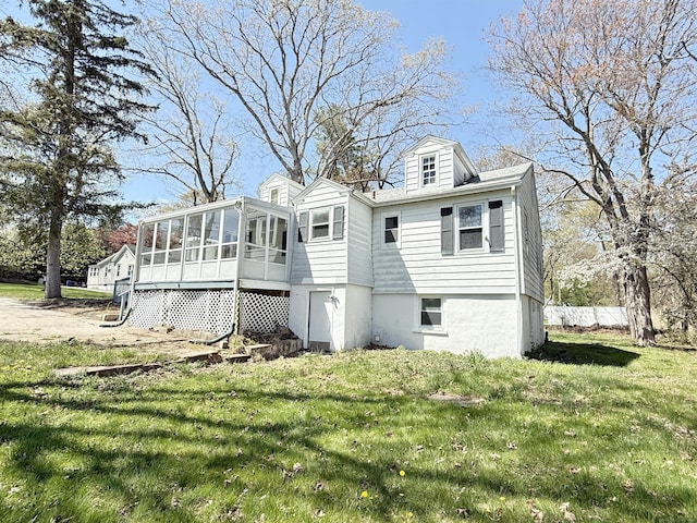 815 Alling Rd, Orange, CT 06477 - back of house featuring a sunroom and a lawn