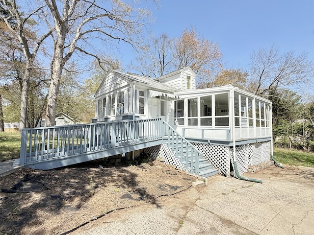815 Alling Rd, Orange, CT 06477 - view of side of home featuring a sunroom and a wooden deck
