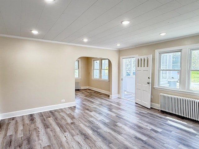 815 Alling Rd, Orange, CT 06477 - foyer featuring arched walkways, radiator, ornamental molding, healthy amount of natural light, and recessed lighting
