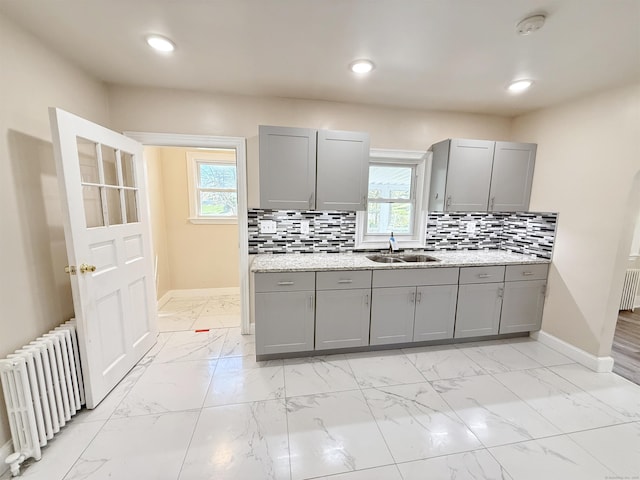 815 Alling Rd, Orange, CT 06477 - kitchen featuring gray cabinetry, radiator heating unit, a sink, baseboards, and recessed lighting
