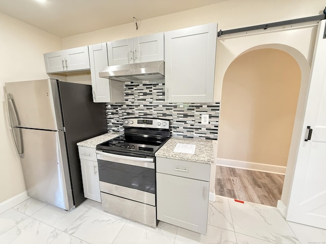 815 Alling Rd, Orange, CT 06477 - kitchen featuring appliances with stainless steel finishes, under cabinet range hood, light marble finish flooring, and baseboards