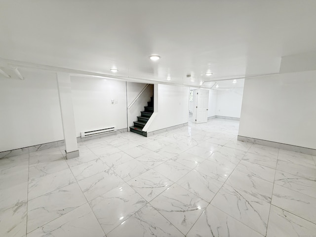 815 Alling Rd, Orange, CT 06477 - finished below grade area with a baseboard radiator, stairway, baseboards, and light marble finish flooring