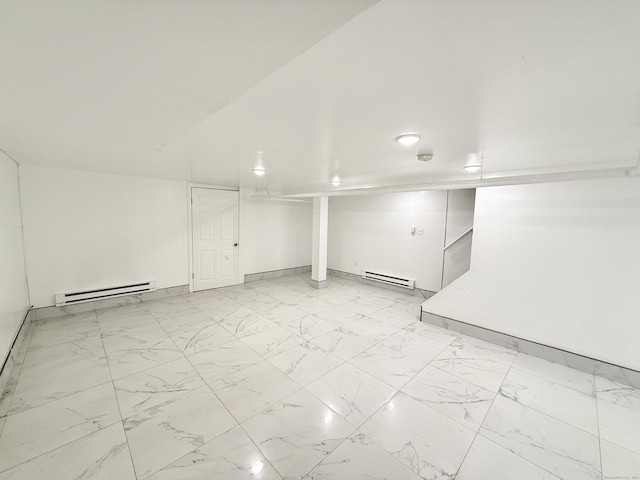 815 Alling Rd, Orange, CT 06477 - finished below grade area featuring a baseboard heating unit, light marble finish flooring, and baseboards