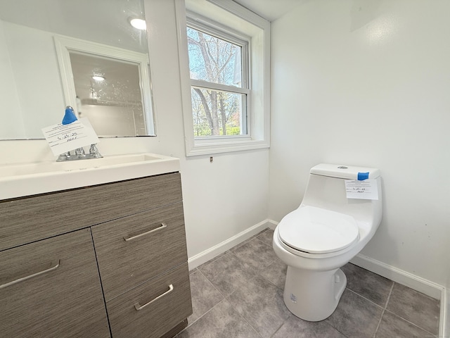 815 Alling Rd, Orange, CT 06477 - half bath featuring baseboards, vanity, tile patterned flooring, and toilet