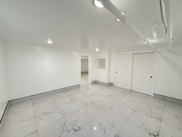 815 Alling Rd, Orange, CT 06477 - below grade area with light marble finish floors and baseboards