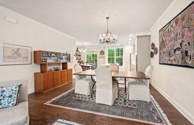 dining room with a chandelier, ornamental molding, dark wood finished floors, baseboards, and recessed lighting