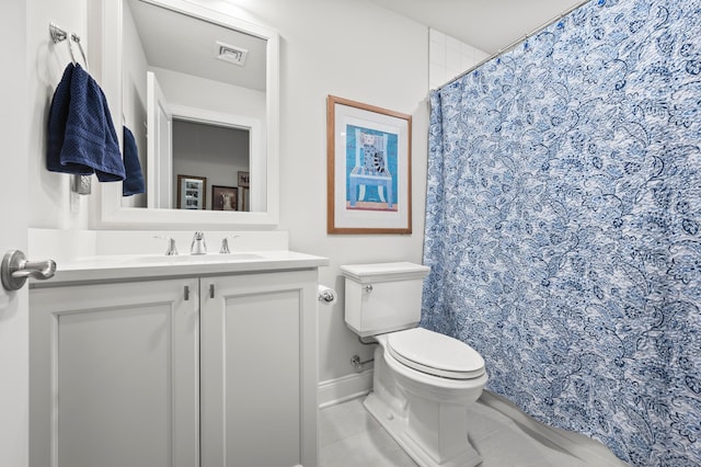 full bath featuring toilet, tile patterned floors, vanity, baseboards, and a shower with shower curtain