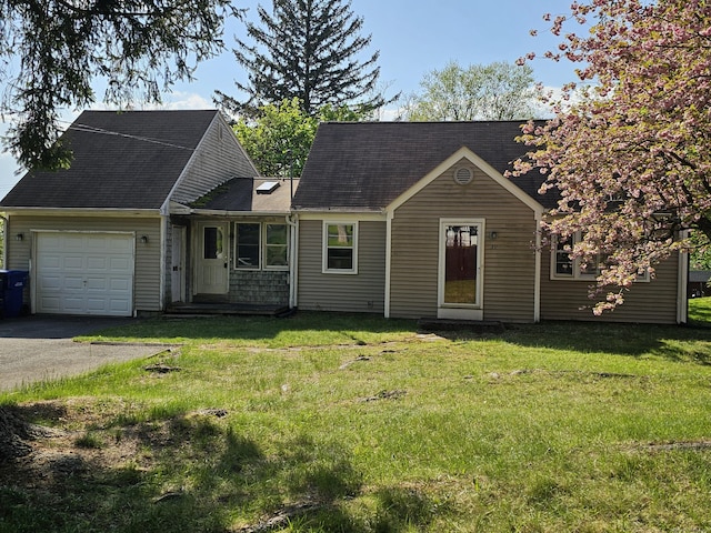 39 Charter Rd, Ellington, CT 06029 - view of front of property featuring an attached garage, asphalt driveway, and a front lawn