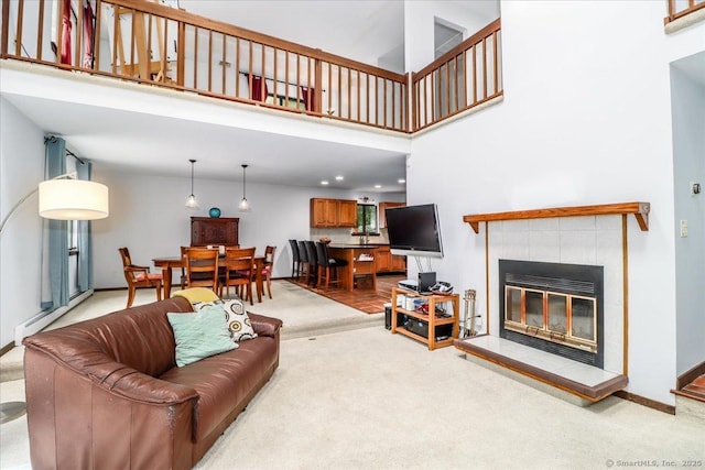 6 Kristy Dr, Bethel, CT 06801 - living room featuring carpet floors, baseboard heating, a fireplace, and a high ceiling