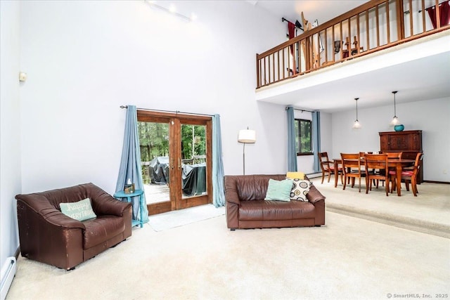 6 Kristy Dr, Bethel, CT 06801 - carpeted living room with baseboard heating and a towering ceiling