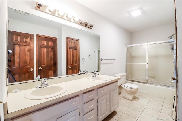 6 Kristy Dr, Bethel, CT 06801 - full bathroom featuring tile patterned floors, double vanity, and bath / shower combo with glass door