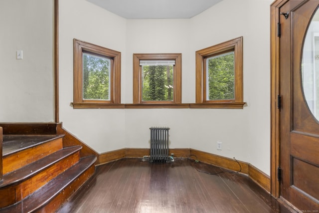 516 Savin Ave, West Haven, CT 06516 - entryway featuring radiator heating unit, wood-type flooring, and stairs
