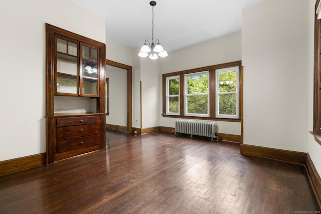 516 Savin Ave, West Haven, CT 06516 - unfurnished room featuring radiator heating unit, dark wood-style flooring, and a chandelier