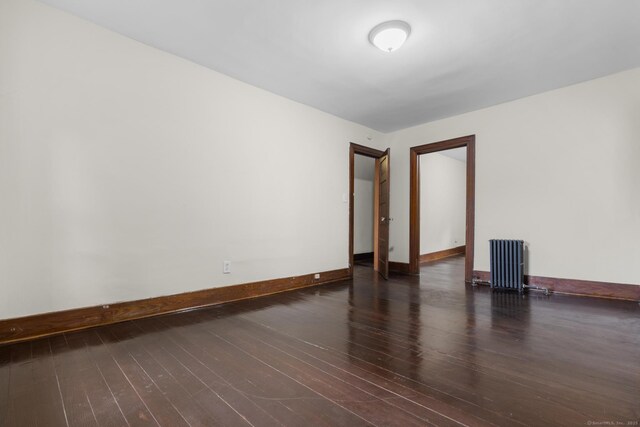 516 Savin Ave, West Haven, CT 06516 - unfurnished room with radiator heating unit and wood finished floors