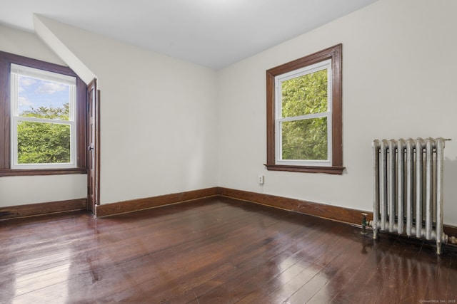 516 Savin Ave, West Haven, CT 06516 - unfurnished room with radiator, healthy amount of natural light, and hardwood / wood-style floors