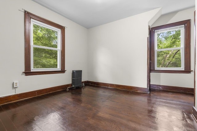 516 Savin Ave, West Haven, CT 06516 - unfurnished room featuring radiator and wood-type flooring