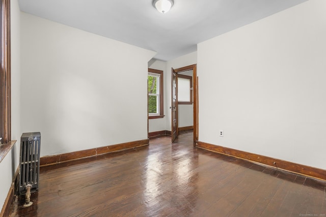 516 Savin Ave, West Haven, CT 06516 - unfurnished room featuring radiator heating unit and dark wood finished floors