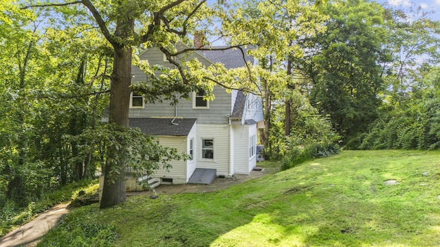 516 Savin Ave, West Haven, CT 06516 - back of house featuring a yard, a chimney, and roof with shingles
