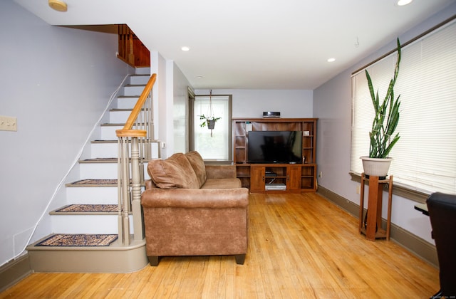 living room with stairs, baseboards, hardwood / wood-style floors, and recessed lighting