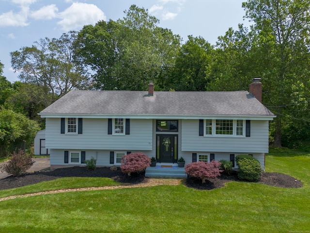 26 Sharon Cir, Meriden, CT 06450 - bi-level home with a chimney, a front lawn, and a shingled roof
