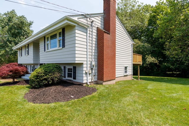 26 Sharon Cir, Meriden, CT 06450 - view of side of property with a chimney and a lawn