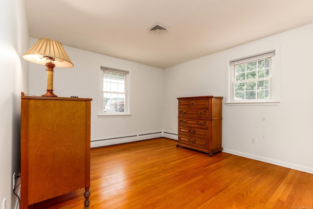 26 Sharon Cir, Meriden, CT 06450 - bedroom featuring baseboard heating and light wood-type flooring