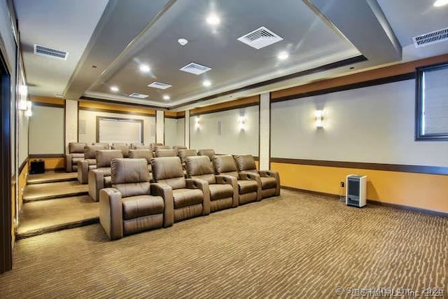 cinema room with carpet flooring and visible vents
