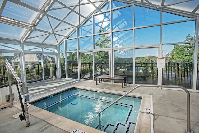 view of swimming pool with a patio area and fence