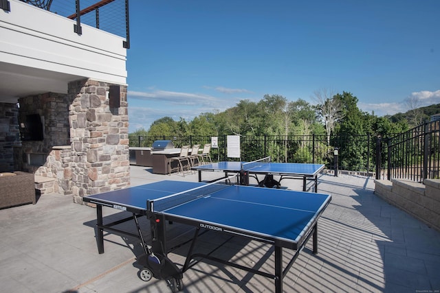view of patio with area for grilling and outdoor dining area