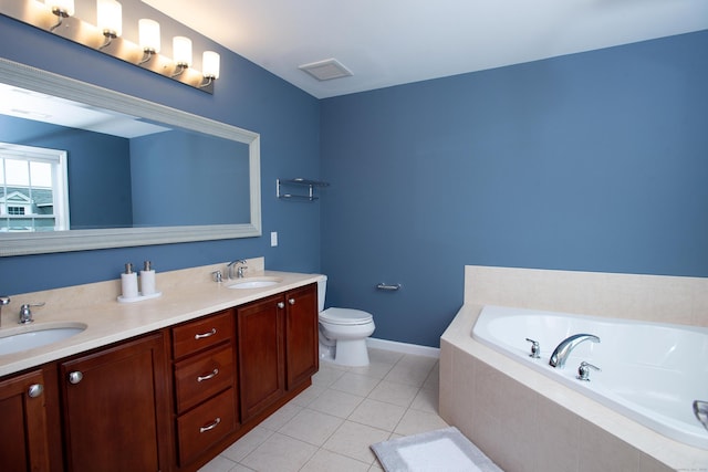 full bath featuring a sink, toilet, a bath, and tile patterned floors