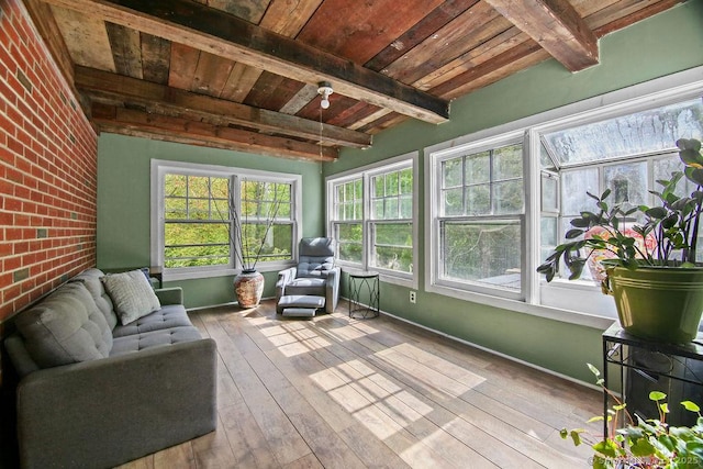 sunroom with wooden ceiling, hardwood / wood-style floors, beam ceiling, and baseboards