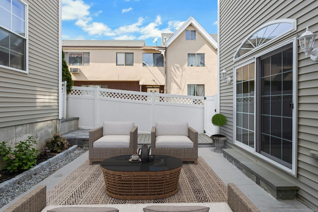 view of patio / terrace featuring fence and outdoor lounge area