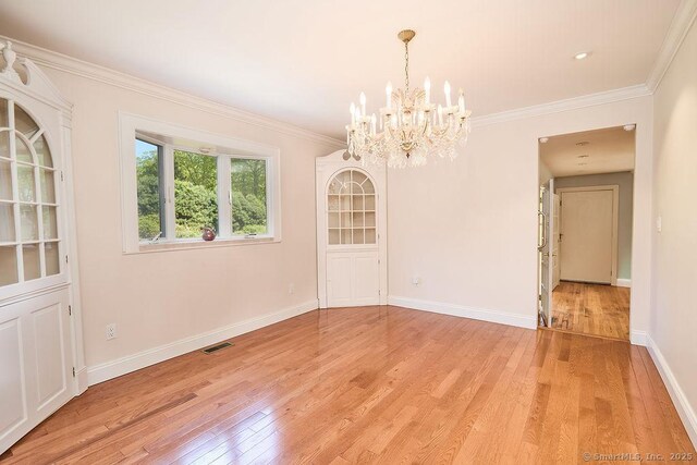 17 Grays Farm Rd, Weston, CT 06883 - unfurnished dining area featuring light wood finished floors, a chandelier, crown molding, and baseboards