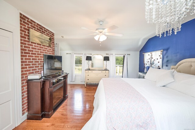 17 Grays Farm Rd, Weston, CT 06883 - bedroom with light wood-type flooring, lofted ceiling, and a ceiling fan