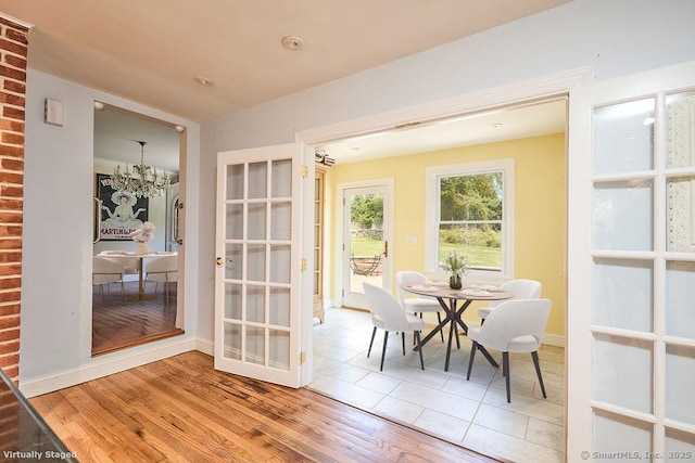 17 Grays Farm Rd, Weston, CT 06883 - dining room featuring a chandelier, wood finished floors, and baseboards