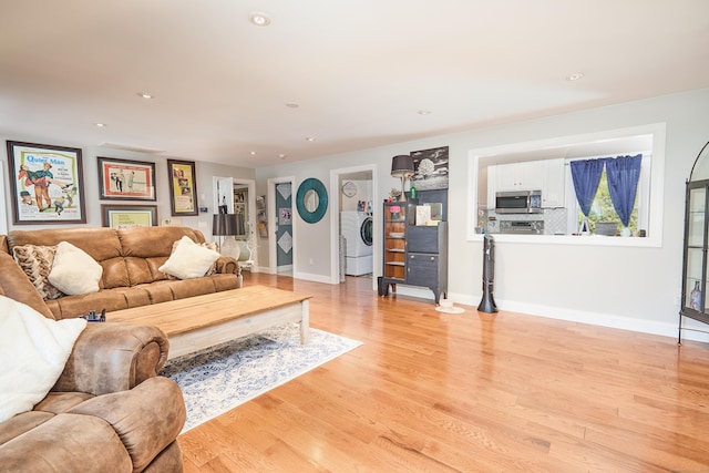 17 Grays Farm Rd, Weston, CT 06883 - living area featuring washer / dryer, light wood-type flooring, baseboards, and recessed lighting