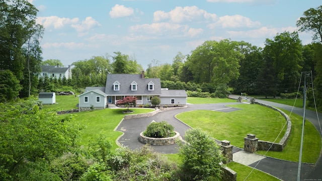 17 Grays Farm Rd, Weston, CT 06883 - rear view of house featuring asphalt driveway, a yard, and a chimney
