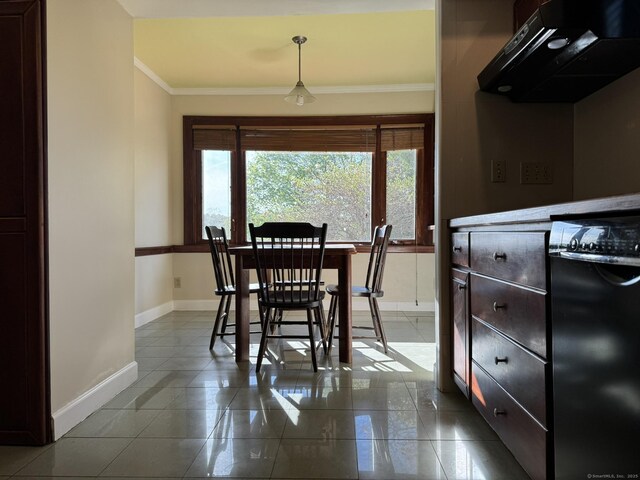 135 Lambert Ave, Meriden, CT 06451 - dining area with ornamental molding, baseboards, and dark tile patterned flooring