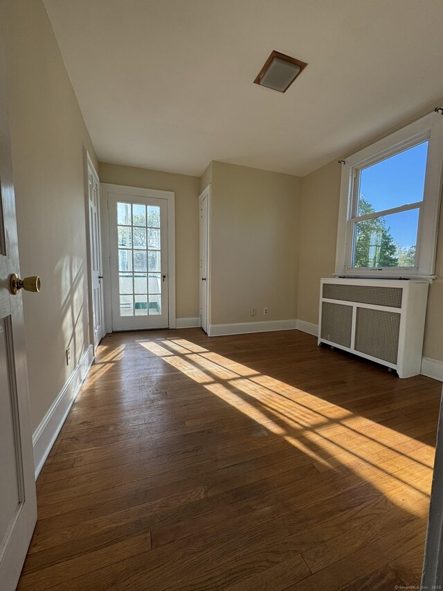 135 Lambert Ave, Meriden, CT 06451 - unfurnished room featuring radiator heating unit, wood finished floors, and baseboards
