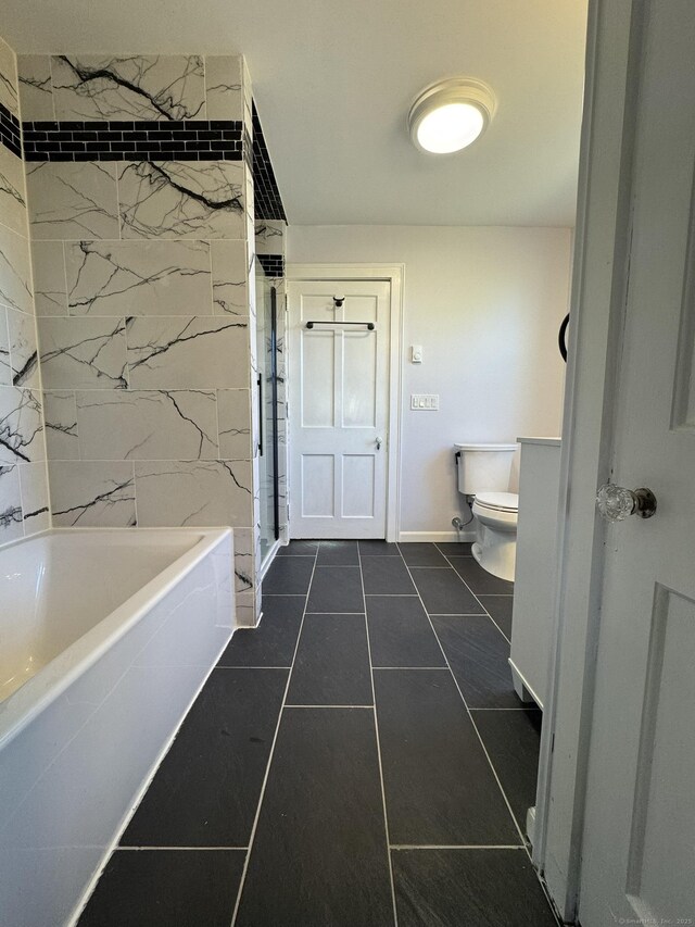 135 Lambert Ave, Meriden, CT 06451 - bathroom with a tub to relax in, toilet, a shower, tile patterned flooring, and baseboards