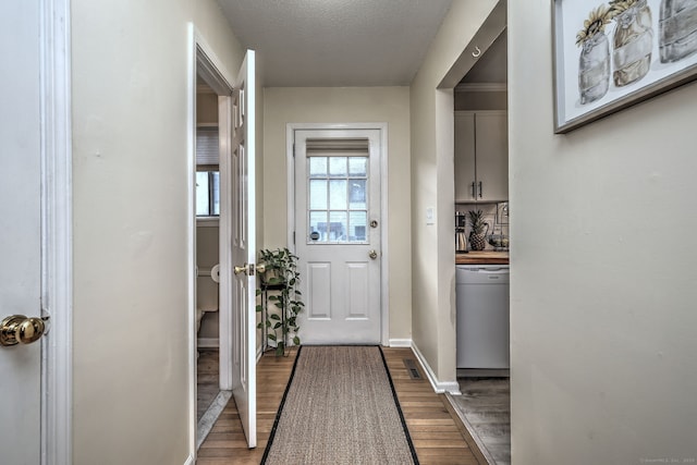 529 Woodward Ave Apt D, New Haven, CT 06512 - entryway with dark wood-style floors, a textured ceiling, and baseboards