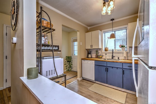 529 Woodward Ave Apt D, New Haven, CT 06512 - kitchen featuring white dishwasher, freestanding refrigerator, a sink, light wood-style floors, and wood counters