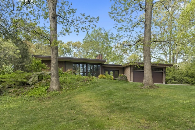 192 Thompson Hill Rd, Portland, CT 06480 - rear view of house with a lawn, a garage, a chimney, and french doors