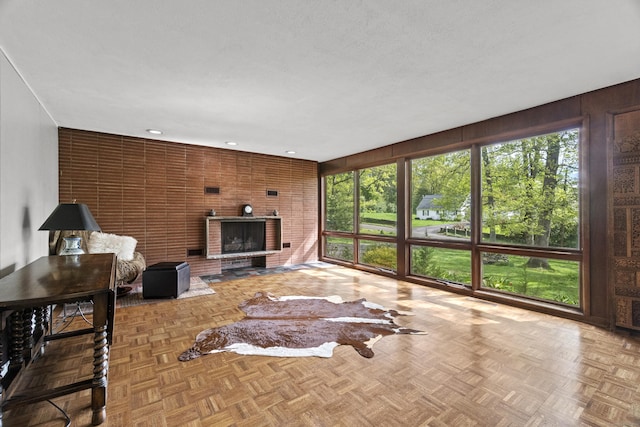 192 Thompson Hill Rd, Portland, CT 06480 - living room featuring a wood stove, recessed lighting, and wooden walls