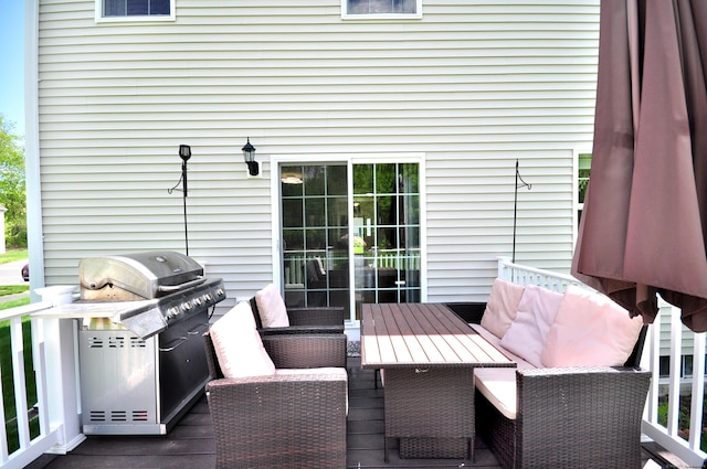 wooden deck with a grill and outdoor dining space