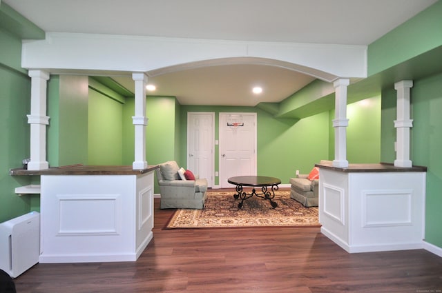 living room featuring dark wood-style flooring, recessed lighting, and baseboards
