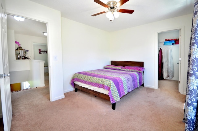 carpeted bedroom with baseboards and a ceiling fan